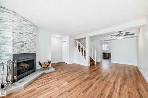 3510 41B Avenue, Edmonton, AB - Indoor Photo Showing Living Room With Fireplace