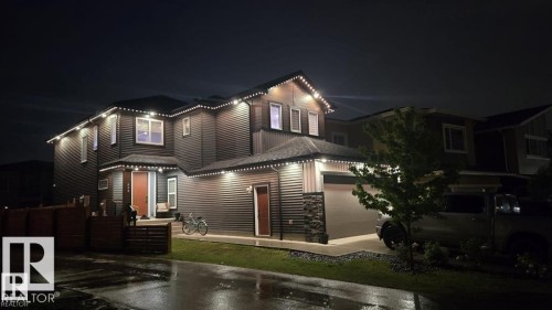 Contemporary two-story exterior with horizontal siding and stone accenting - 228 36 Street, Edmonton, AB 