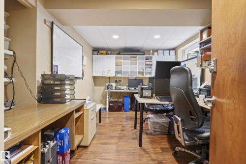 Dedicated office space with wood-finish flooring and recessed lighting - 9 Emerald Terrace, St. Albert, AB 
