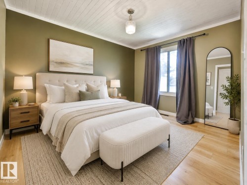 Bedroom featuring light wood-finish flooring, olive green walls, and a white plank ceiling - 8318 80 Avenue, Edmonton, AB 