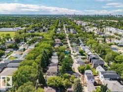 Aerial perspective showcasing a residential area with mature tree-lined streets - 