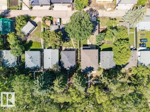 Aerial perspective showcasing residential properties with established landscaping - 8318 80 Avenue Nw, Edmonton, AB - Outdoor With View
