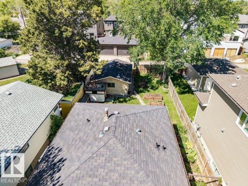 Aerial perspective showcasing a property with a dark shingle roof and a chimney - 8318 80 Avenue Nw, Edmonton, AB - Outdoor