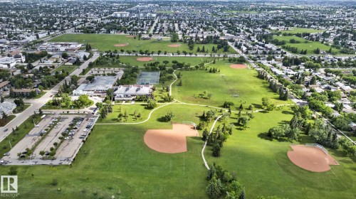 Expansive community parkland featuring multiple baseball diamonds, tennis courts, and walking paths - 12952 114 Street Nw, Edmonton, AB 