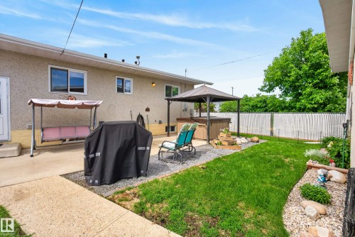 Concrete patio featuring an overhead gazebo structure and direct access to the interior - 10935 152 Street, Edmonton, AB 