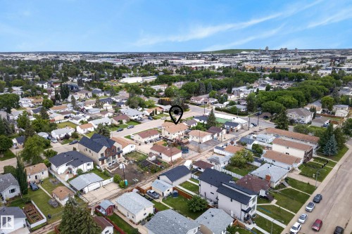 Aerial view showcasing a residential neighborhood with a mix of single-family homes and multi-story residences - 10935 152 Street, Edmonton, AB 