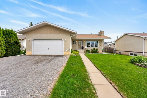 Ranch-style exterior with stucco siding and a peaked roofline - 10935 152 Street, Edmonton, AB 