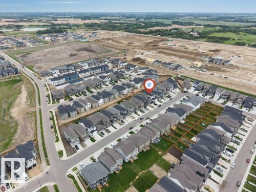Aerial perspective showcasing a residential development with established homes and ongoing construction - 423 28 Street, Edmonton, AB 