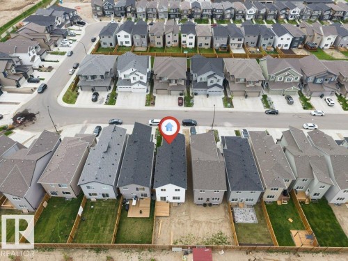 Aerial perspective showcasing a residential neighborhood with numerous detached homes - 423 28 Street, Edmonton, AB 