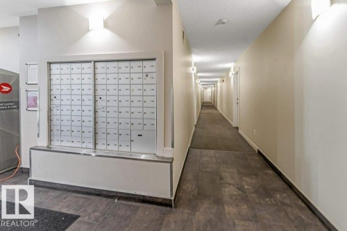Shared hallway featuring recessed lighting and wall sconces - 401 667 Watt Boulevard, Edmonton, AB 