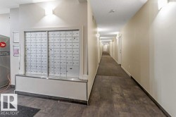 Shared hallway featuring recessed lighting and wall sconces - 