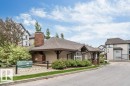 Community clubhouse with brick chimney detail and covered entry - 401 667 Watt Boulevard, Edmonton, AB 