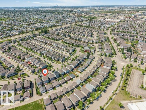 Aerial view of a residential community featuring numerous single-family homes with gray roofs and varied lot sizes - 3511 15A Street, Edmonton, AB 