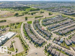 Aerial view showcasing a residential neighborhood with numerous single-family homes - 