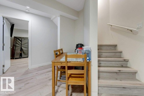 Light wood-finish flooring extending into an open doorway - 3511 15A Street, Edmonton, AB 