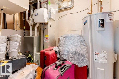 Utility area featuring a water heater, furnace, and humidifier - 3511 15A Street, Edmonton, AB 