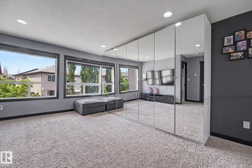 Room featuring wall-to-wall carpeting and recessed lighting - 1944 68 Street, Edmonton, AB 
