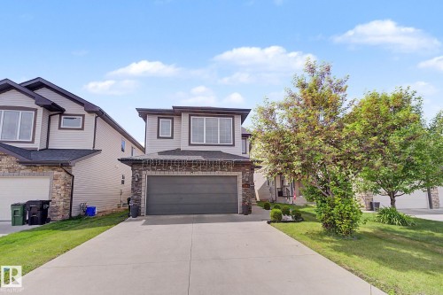 Contemporary two-story residence featuring a stone and siding exterior - 1944 68 Street, Edmonton, AB 