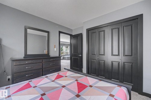 Interior room featuring light gray walls and dark gray architectural trim - 1944 68 Street, Edmonton, AB 