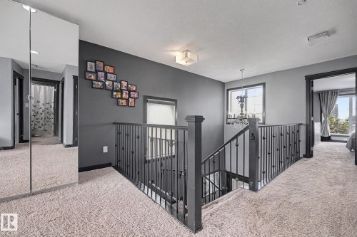 Upper-level landing featuring plush carpet flooring - 1944 68 Street, Edmonton, AB 