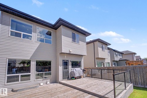 Expansive rear deck with glass panel railing and privacy fence - 1944 68 Street, Edmonton, AB 