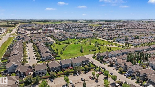Residential development featuring a mix of single-family homes and townhomes - 1944 68 Street, Edmonton, AB 