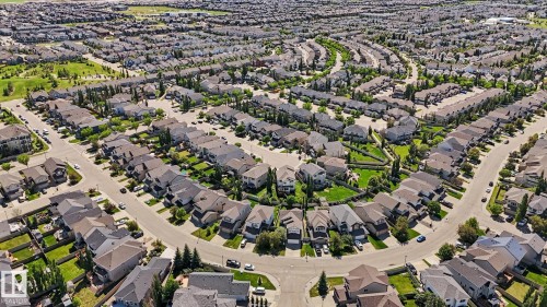 Aerial perspective showcasing a residential community with numerous detached properties - 1944 68 Street, Edmonton, AB 