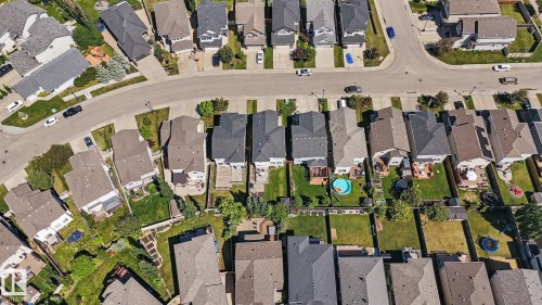 Well-defined suburban neighborhood featuring paved streets and uniformly pitched roofs - 1944 68 Street, Edmonton, AB 