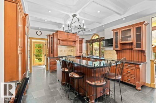 Custom Cherry wood kitchen cabinets with island and two sinks. - 738 Wheeler Road, Edmonton, AB 