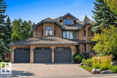 Paving stone driveway and reclaimed brick exterior. - 738 Wheeler Road, Edmonton, AB 