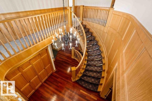 Curved oak staircase featuring luxury wool carpeting. - 738 Wheeler Road, Edmonton, AB 