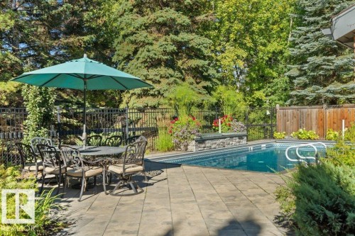 View of pool featuring a patio and outdoor dining space - 738 Wheeler Road, Edmonton, AB 