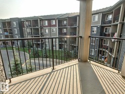 Concrete balcony with black metal railings - 