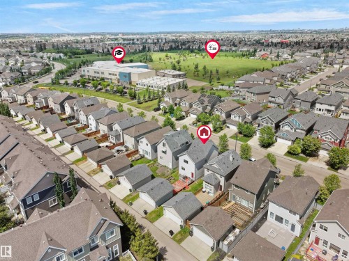 Aerial perspective showcasing a residential neighborhood with diverse housing styles - 7827 22 Avenue, Edmonton, AB 