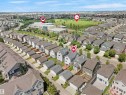 Aerial perspective showcasing a residential neighborhood with diverse housing styles - 7827 22 Avenue, Edmonton, AB 