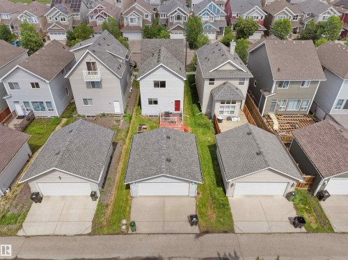 Single-family residence with light gray siding and a dark gray shingle roof - 7827 22 Avenue, Edmonton, AB 