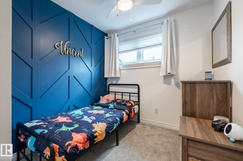 Accent wall featuring geometric wood paneling - 27 Danforth Crescent, St. Albert, AB 