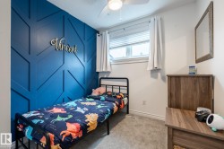 Accent wall featuring geometric wood paneling - 