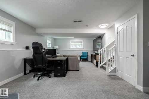 Finished lower level with soft gray carpeting and light gray walls - 27 Danforth Crescent, St. Albert, AB 