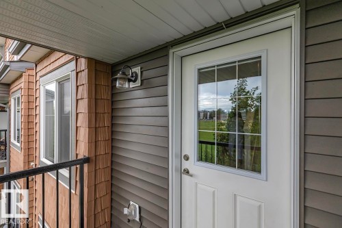 White panel exterior door with divided light window - 22 3025 151 Avenue, Edmonton, AB 