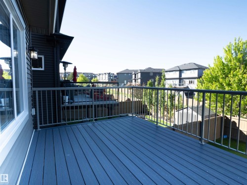 Elevated deck featuring composite decking and metal railings - 2526 Wonnacott Loop, Edmonton, AB 