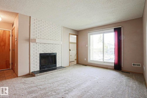 203 44 Alpine Place, St. Albert, AB - Indoor Photo Showing Living Room With Fireplace
