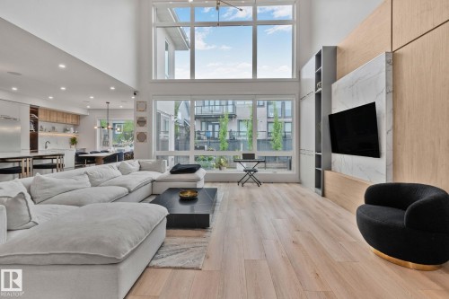 Expansive living space featuring soaring ceilings and large windows - 4509 Wingfield Bay Bay, Edmonton, AB 
