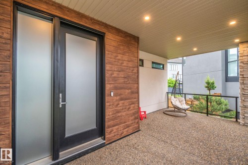 Covered patio with exposed aggregate flooring - 4509 Wingfield Bay Bay, Edmonton, AB 