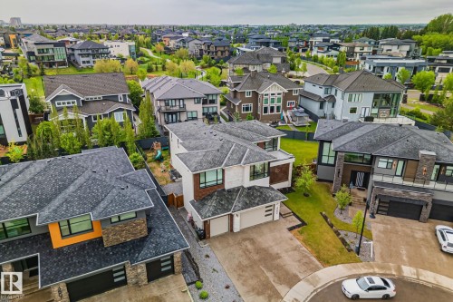 Contemporary residential architecture featuring diverse exterior finishes and multi-level designs - 4509 Wingfield Bay Bay, Edmonton, AB 