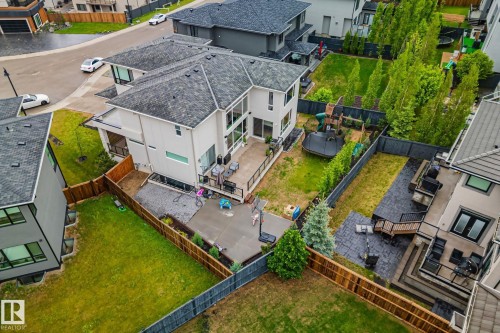 Modern two-story residence with a light-colored exterior and multi-paned windows - 4509 Wingfield Bay Bay, Edmonton, AB 
