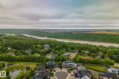 Aerial perspective showcasing a residential area with a river and expansive green spaces - 4509 Wingfield Bay Bay, Edmonton, AB 