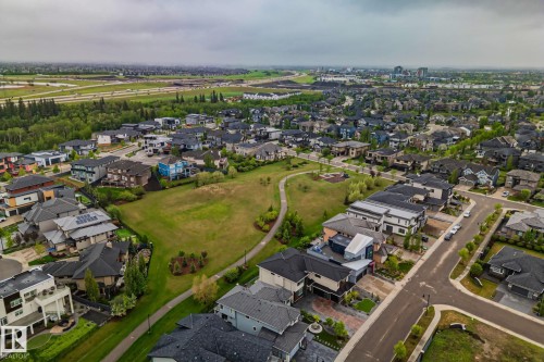 Expansive residential development featuring a variety of architectural styles and rooflines, including several properties with visible solar panels - 4509 Wingfield Bay Bay, Edmonton, AB 