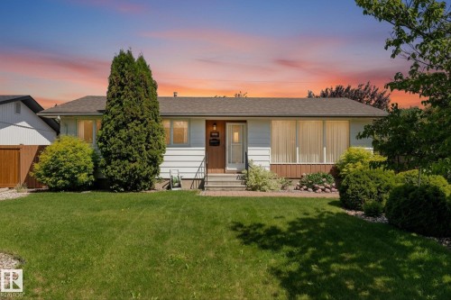 Single-story residence featuring white siding and a brown shingle roof - 15112 76A Avenue, Edmonton, AB 