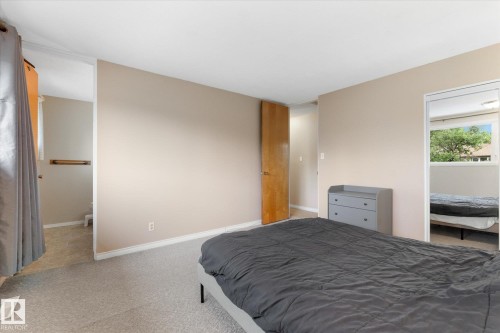 Neutral-toned walls complement the light-colored carpeting - 15112 76A Avenue, Edmonton, AB 